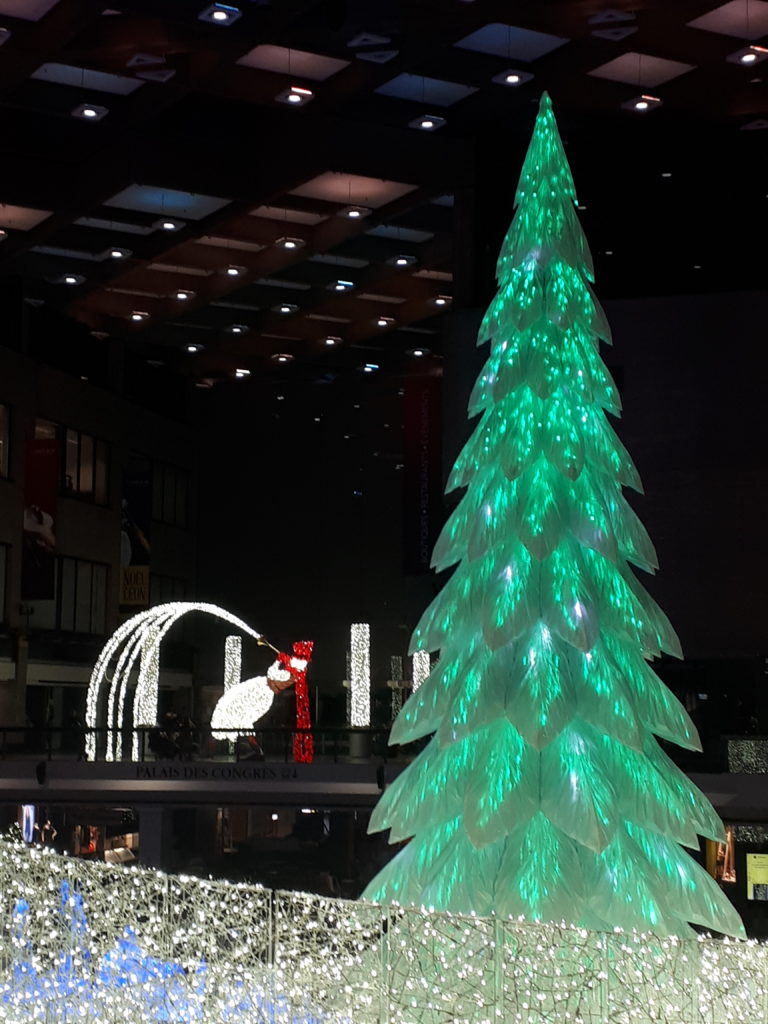 A lightshow featuring a trumpet-playing snowman and a Christmas tree, as part of the LuminoThérapie festival