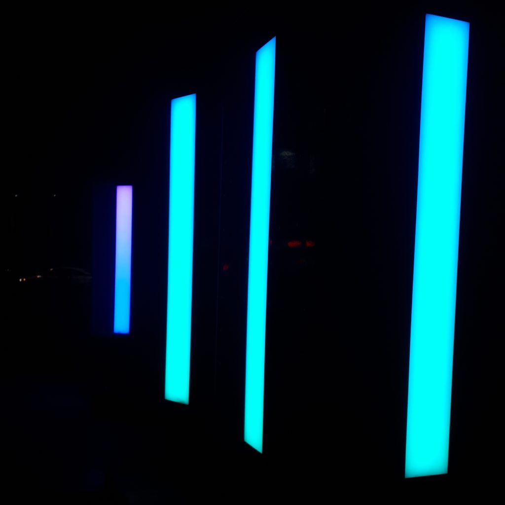 Narrow lightboxes, about 10 feet tall, at LuminoThérapie lightshow festival