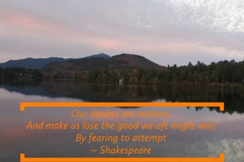 a poster of a lake at sunset, with a Shakespeare quote "Our doubts are traitors, And make us lose the good we oft might win, By fearing to attempt"