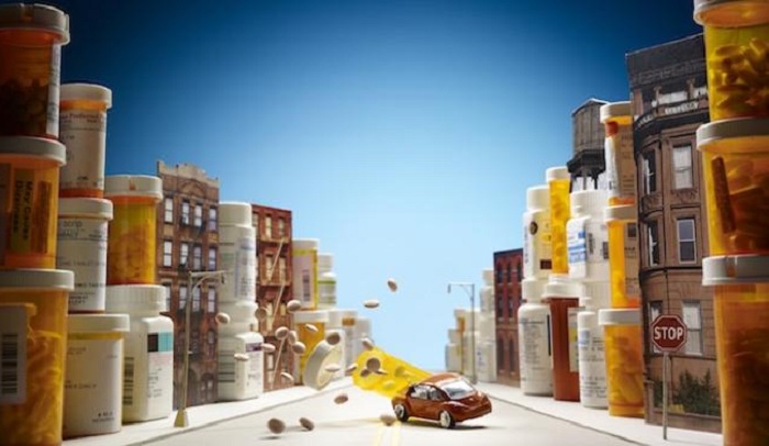 an image of toy cars crashing and pills flying