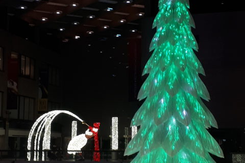 A lightshow featuring a trumpet-playing snowman and a Christmas tree, as part of the LuminoThérapie festival