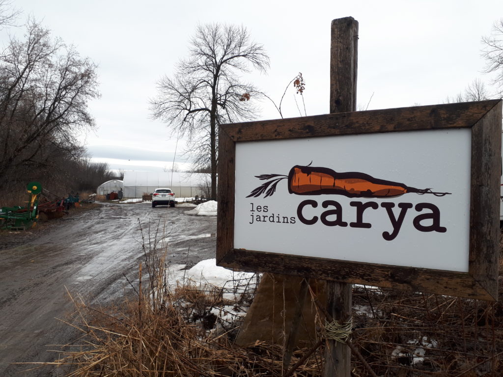 A sign at a farm, for Les Jardins Carya (the Carya Gardens)