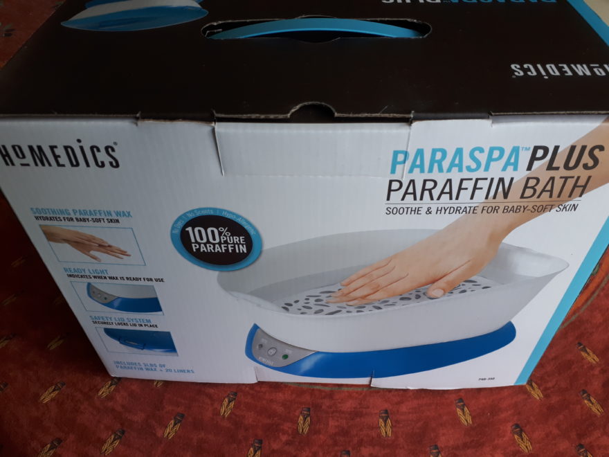a home-use paraffin wax unit, just large enough to dip one's hand into hot wax