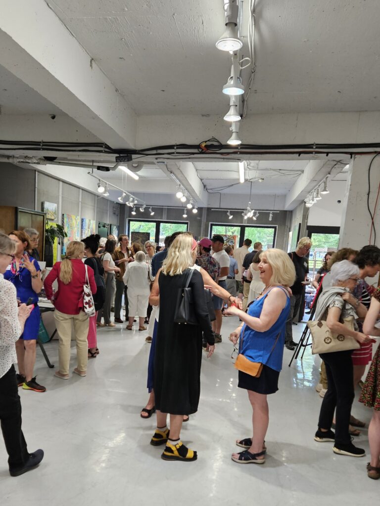 The crowd at the opening night Vernissage of the summer 2024 art show of Artists in Montréal, at the Galerie BOA Gallery in Old Montréal