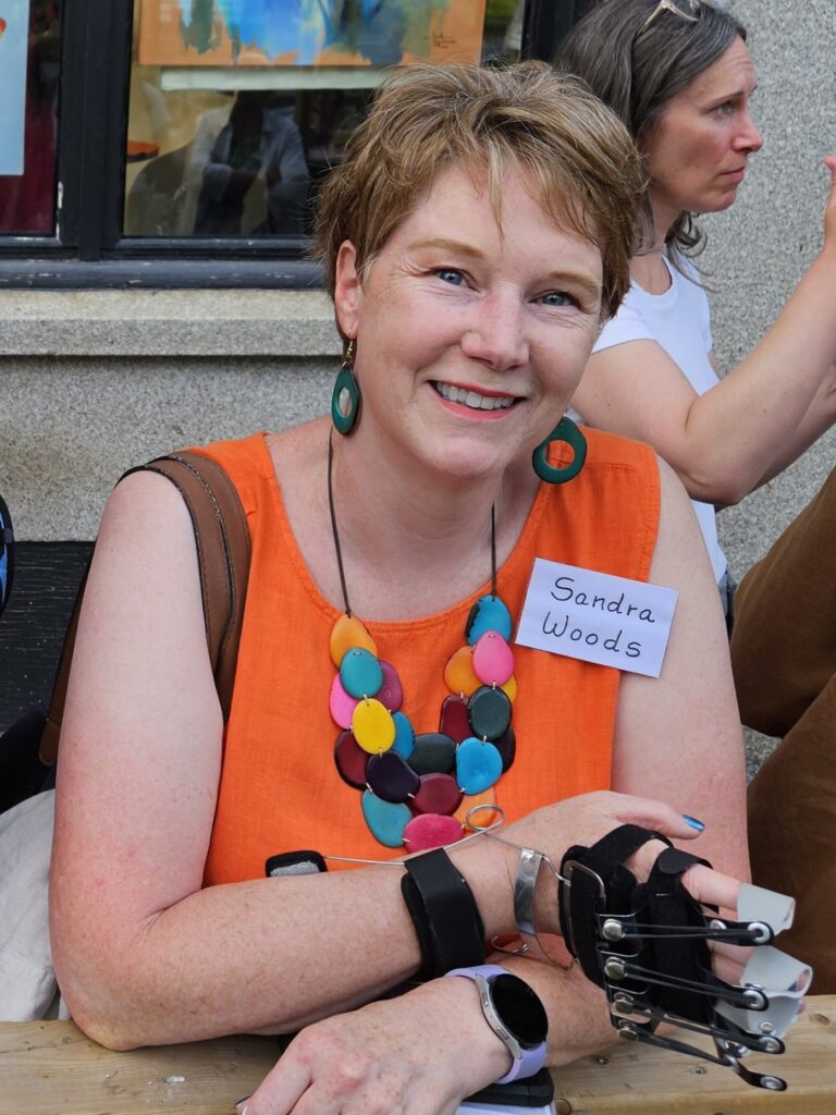 Sandra Woods outside the Galerie BOA Gallery, wearing a sleeveless linen dress, during the opening night Vernissage of an art show