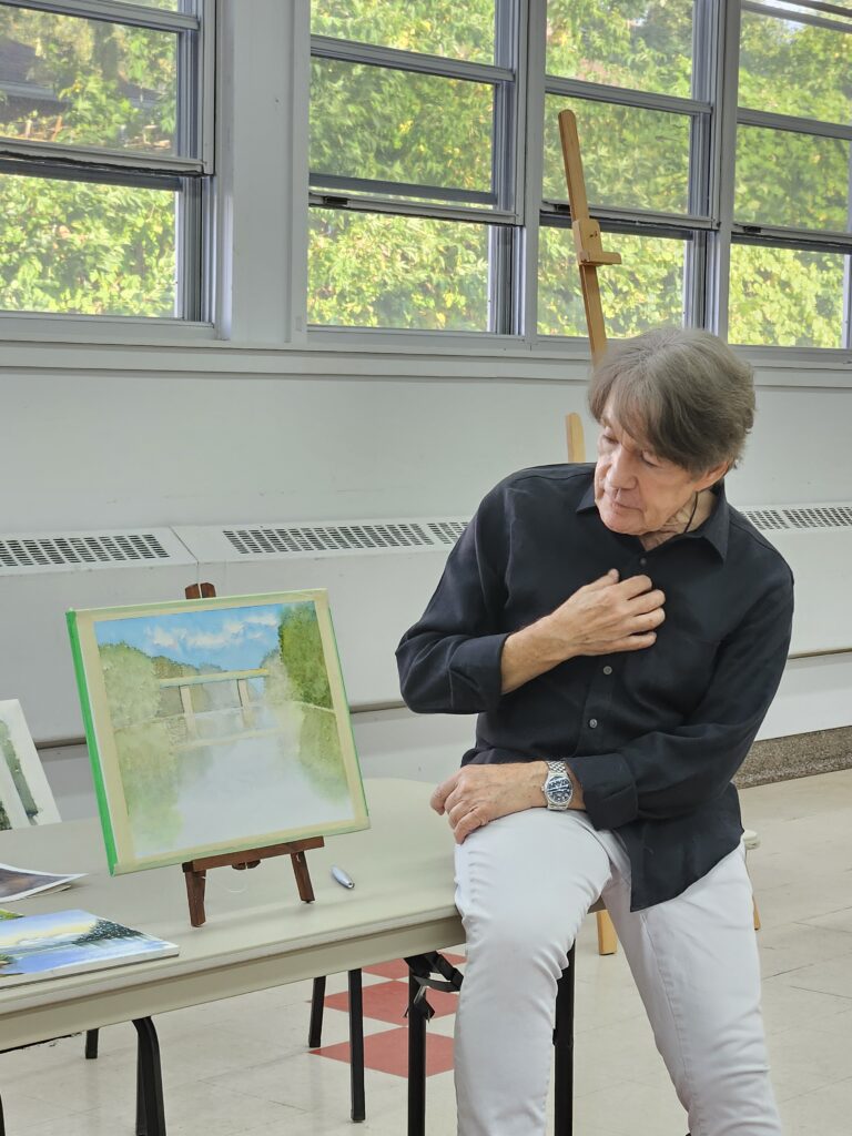 Thomas W. Schaller, at a Masterclass hosted by the Atelier d'aquarelle le Partage, commenting on an unfinished watercolour painting of an old railway bridge by Sandra Woods