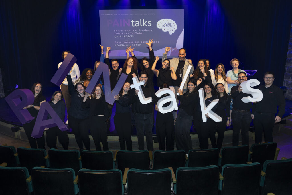 Photo of all presenters and QNJPI volunteer event organizers onstage, after PAINtalks 2024, Nov 7, 2024 at The Gesù in Montréal